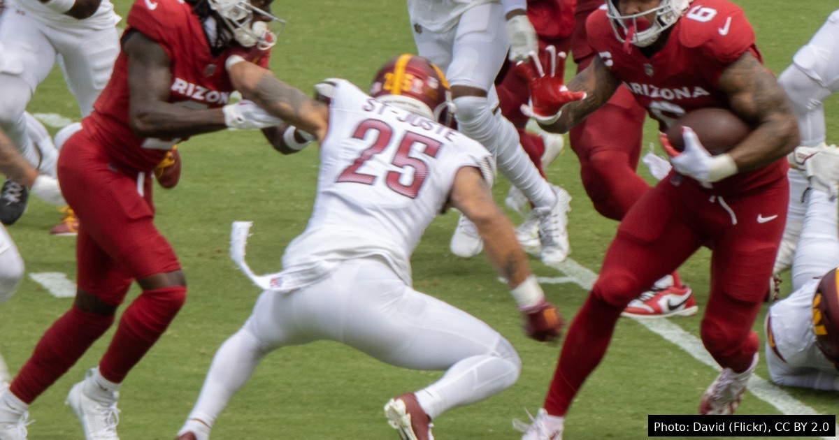 James Conner in Arizona Cardinals uniform carrying the ball